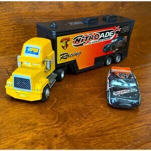 DISNEY Pixar Cars Nitroade Hauler Semi Truck & 28 Aiken Axler Diecast